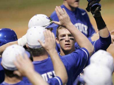  Kentucky baseball players give high five's after home run 