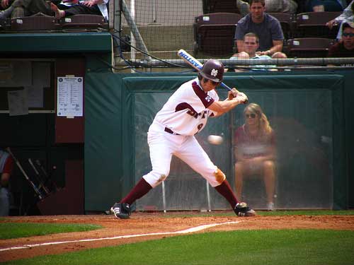 MSU batter watches baseball cross the plate