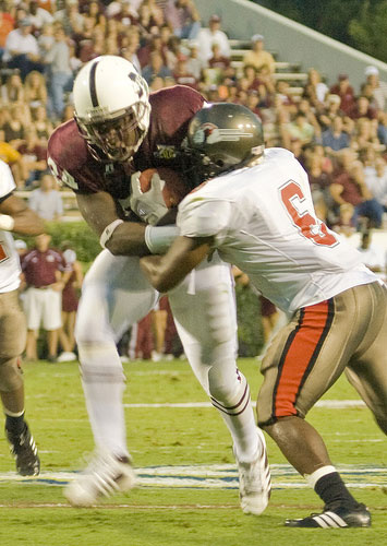 Gardner-Webb player tries to strip football from Bulldog runner