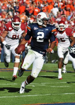 Cam Newton runs the ball in Arkansas game